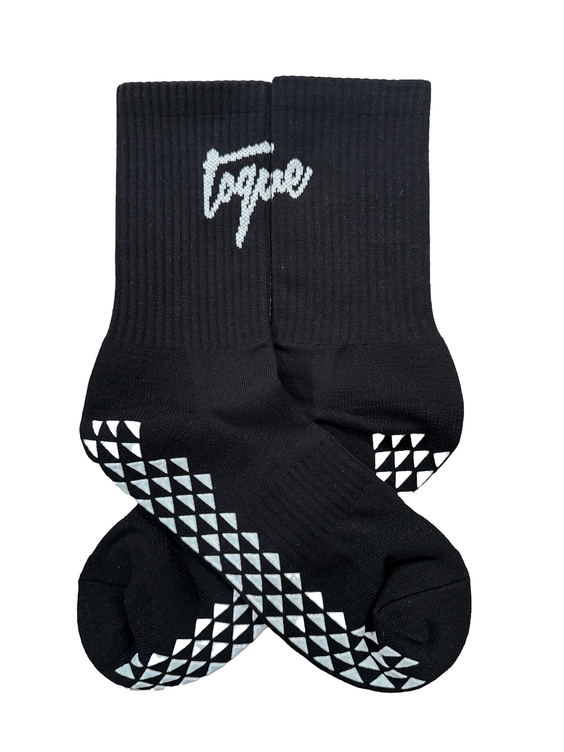 Black socks with white geometric patterns and 'toque' branding on a white background